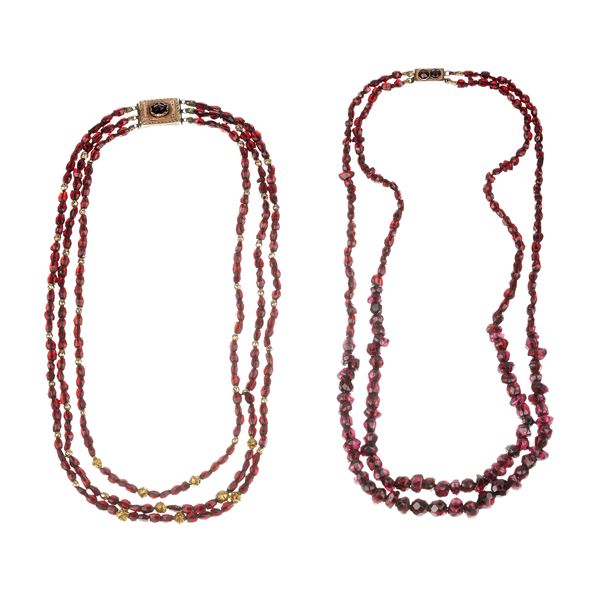 Three-strand necklace in garnets, 18 and 9 kt gold, and another two-strand necklace in garnets and 9 kt gold