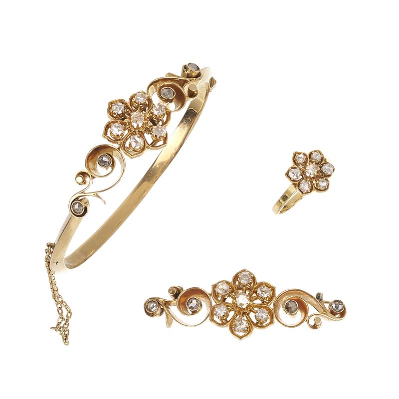 Spilla a barretta, bracciale rigido e anello in oro rosa 18 kt e diamanti