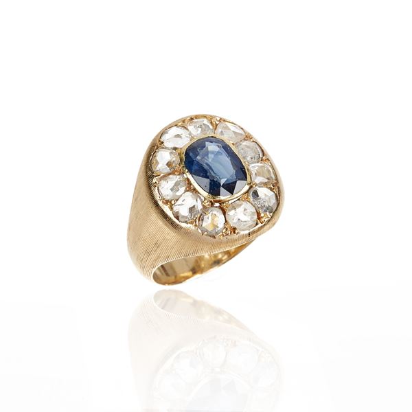 Ring in 18 kt yellow gold, diamonds and sapphire