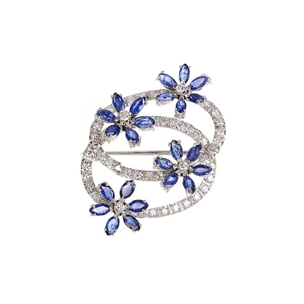 Floral brooch in 18 kt white gold, diamonds and sapphires