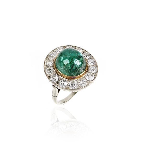 Ring in 14 kt white gold, yellow gold, diamonds and emerald