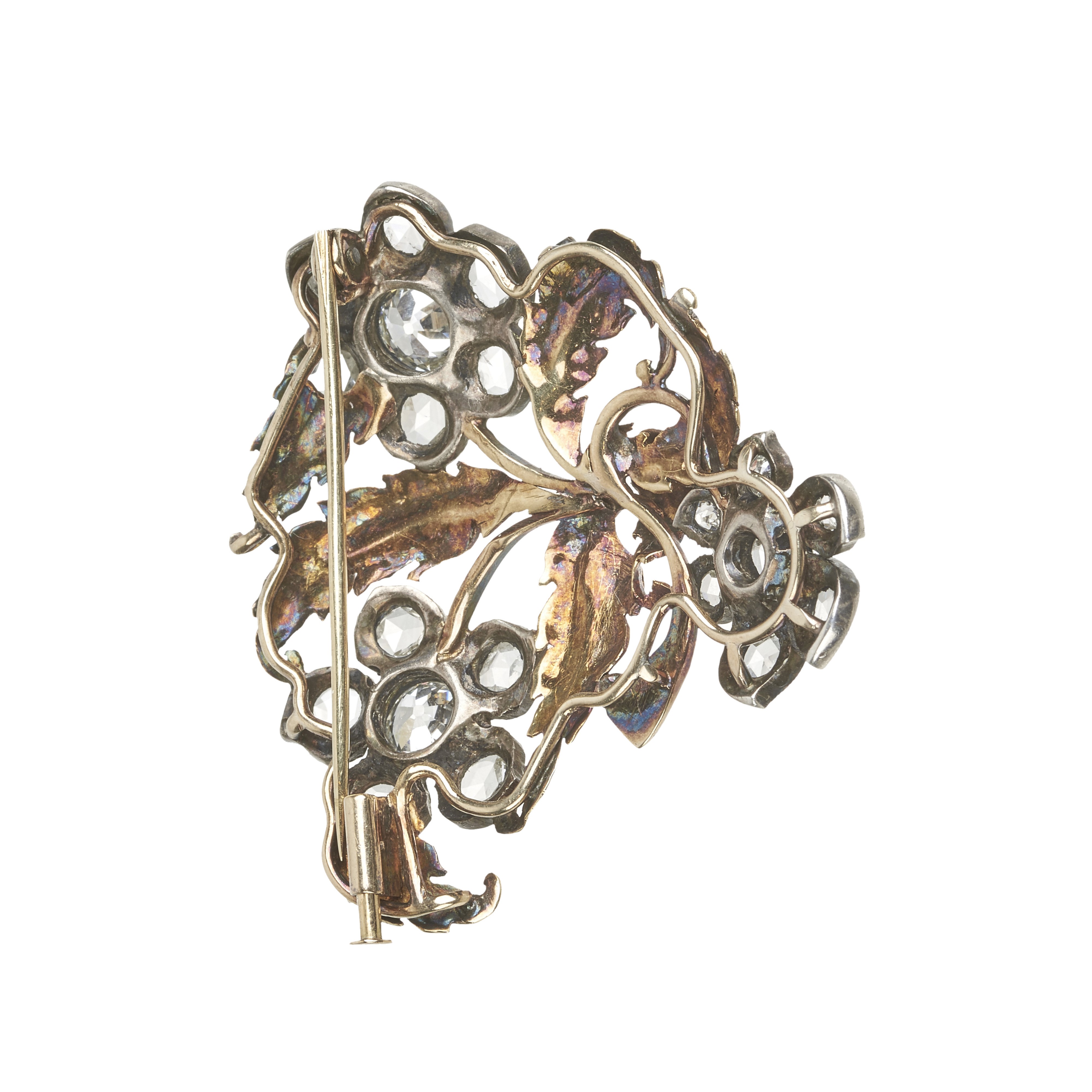 Spilla floreale in oro giallo 14 kt, argento e diamanti