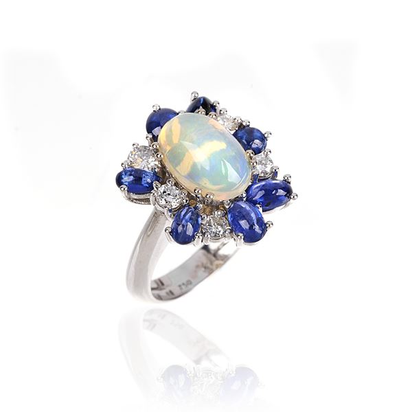 Ring in 18 kt white gold with diamonds, sapphires and opal