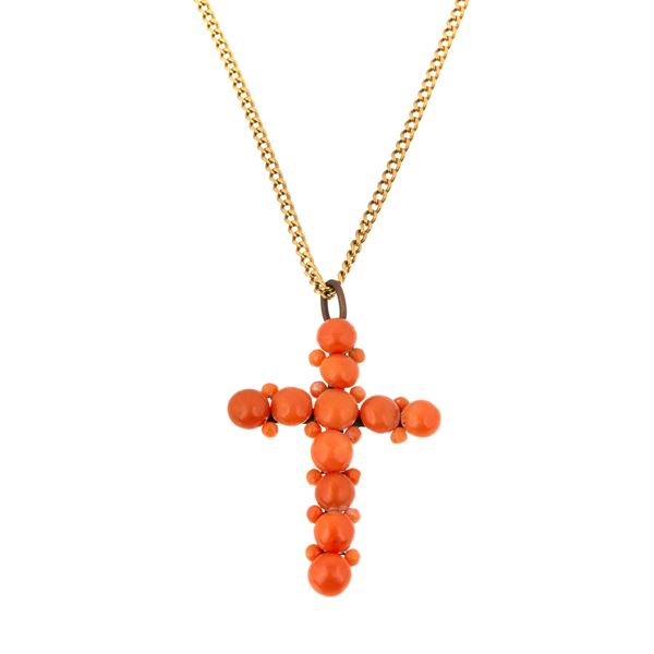 Yellow gold link chain and cross in coral and gold metal