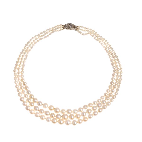 Three-strand necklace of degradé pearls, white gold and diamonds