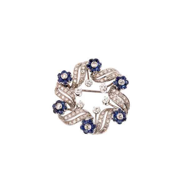 Garland brooch in white gold, diamonds and sapphires