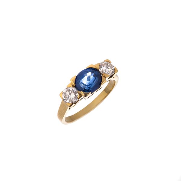 Bridge ring in 18 kt yellow gold, diamonds and sapphire