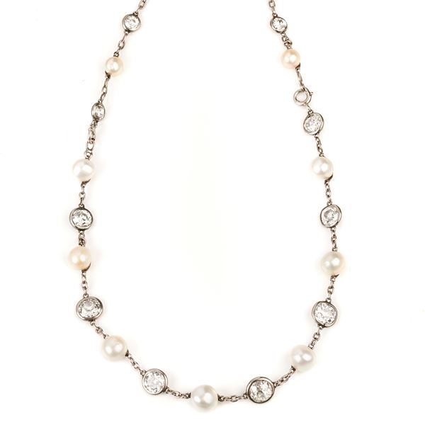 Long necklace convertible into four bracelets in platinum, diamonds and pearls