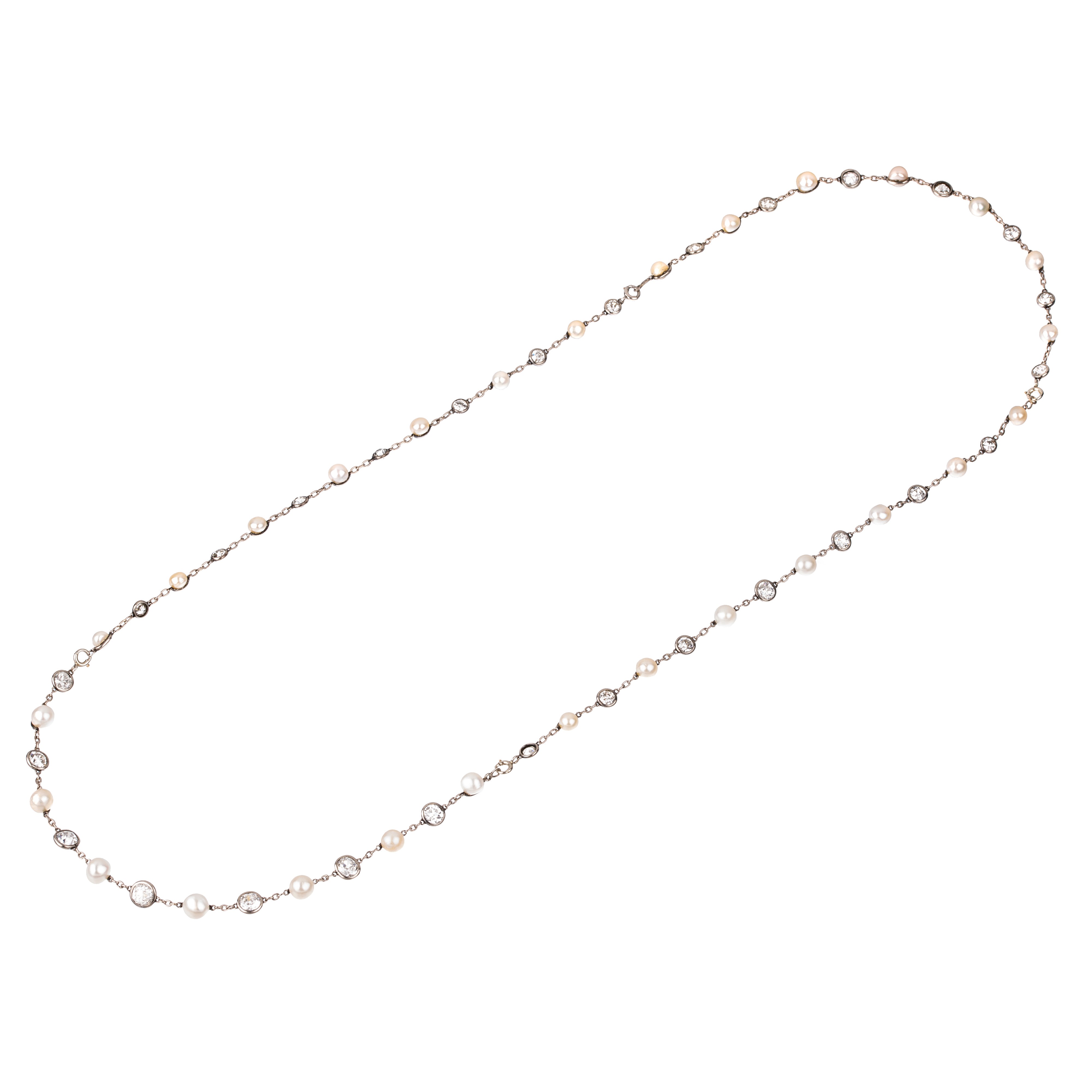 Lunga Collana trasformabile in quattro bracciali in platino, diamanti e perle