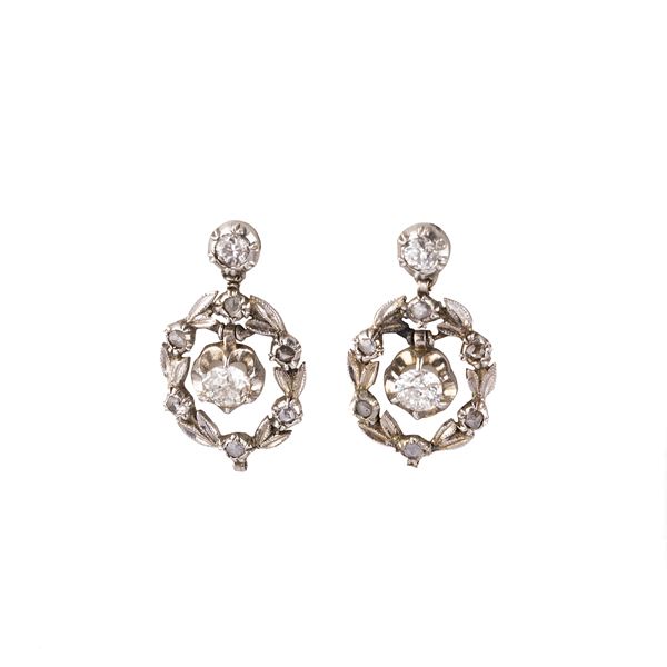Pair of white gold and diamond pendant earrings