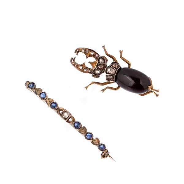 Stag beetle brooch in silver, garnet and diamond roses and a bar brooch with sapphires
