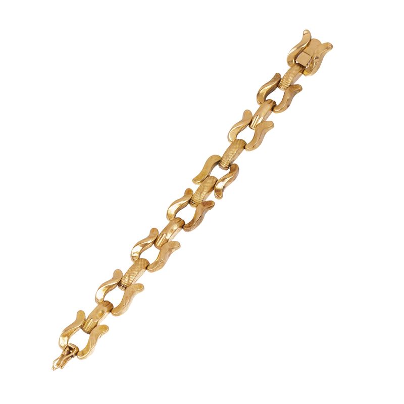 Bracciale a maglie sagomate alternate a maglie rettangolari bombate in oro 18 kt inciso