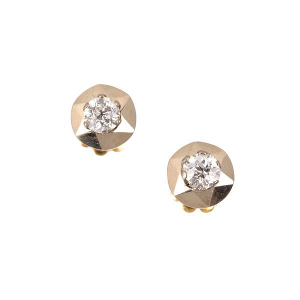 Pair of Punto Luce earrings in 18 kt white and yellow gold