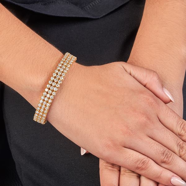 Important tennis bracelet in 18 kt yellow gold and diamonds