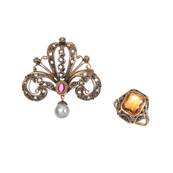 Brooch in low title gold, silver, diamonds, ruby and pearl and a similar ring with yellow stone