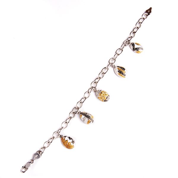 Link bracelet with 14 kt white gold charms and yellow and black diamonds