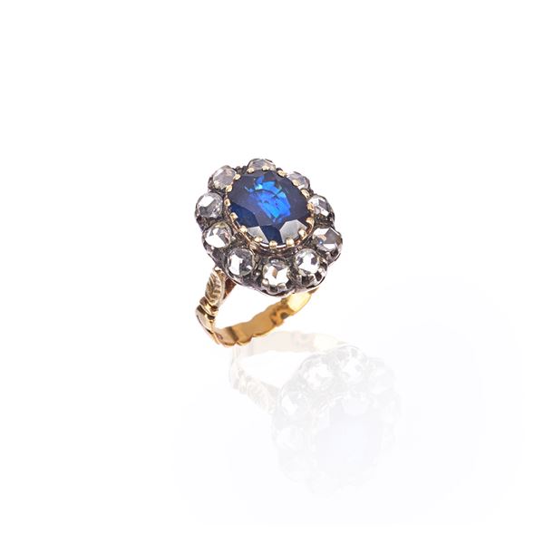 Ring in silver, yellow gold, diamonds and sapphire