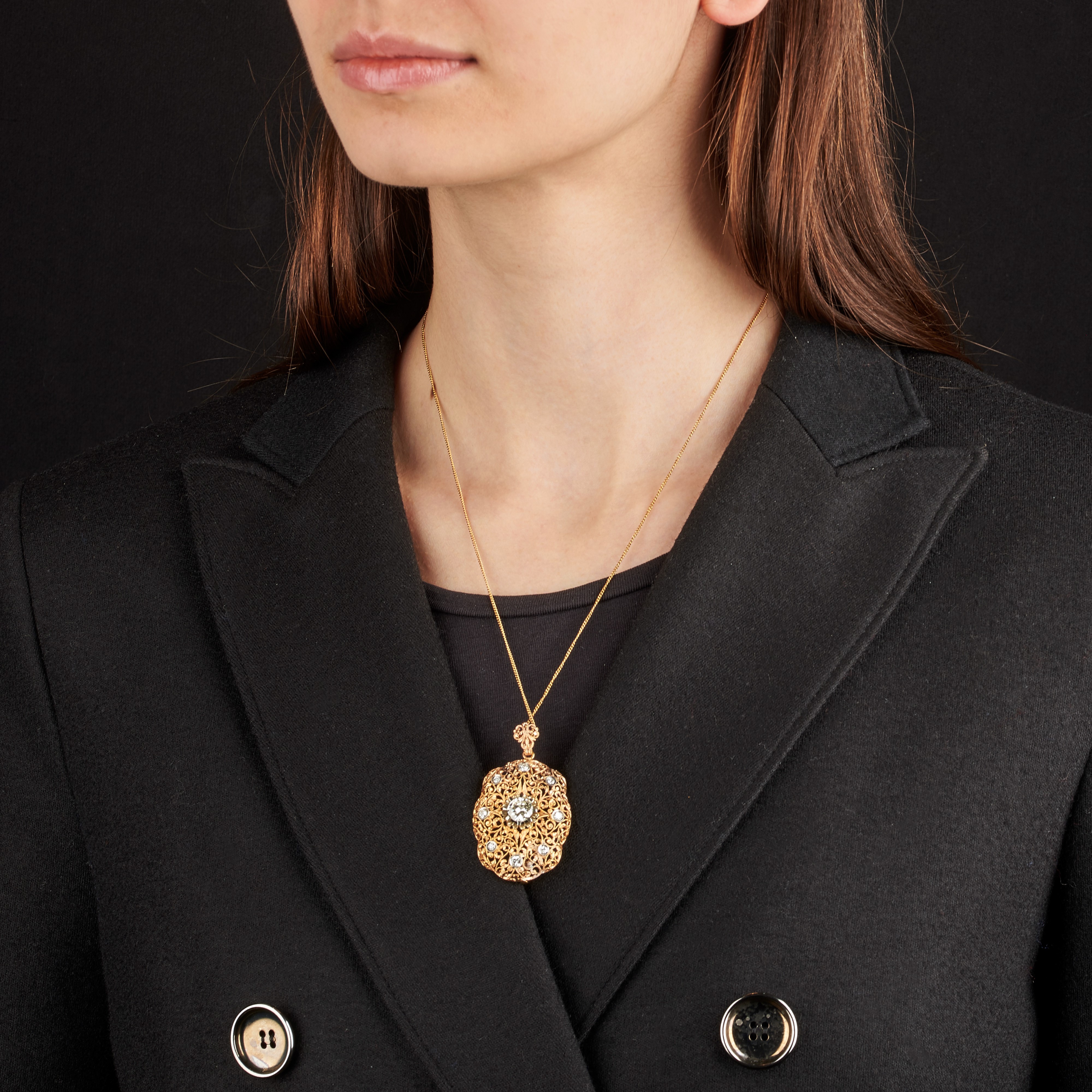 Spilla pendente in oro giallo, 18 kt, oro bianco e diamanti