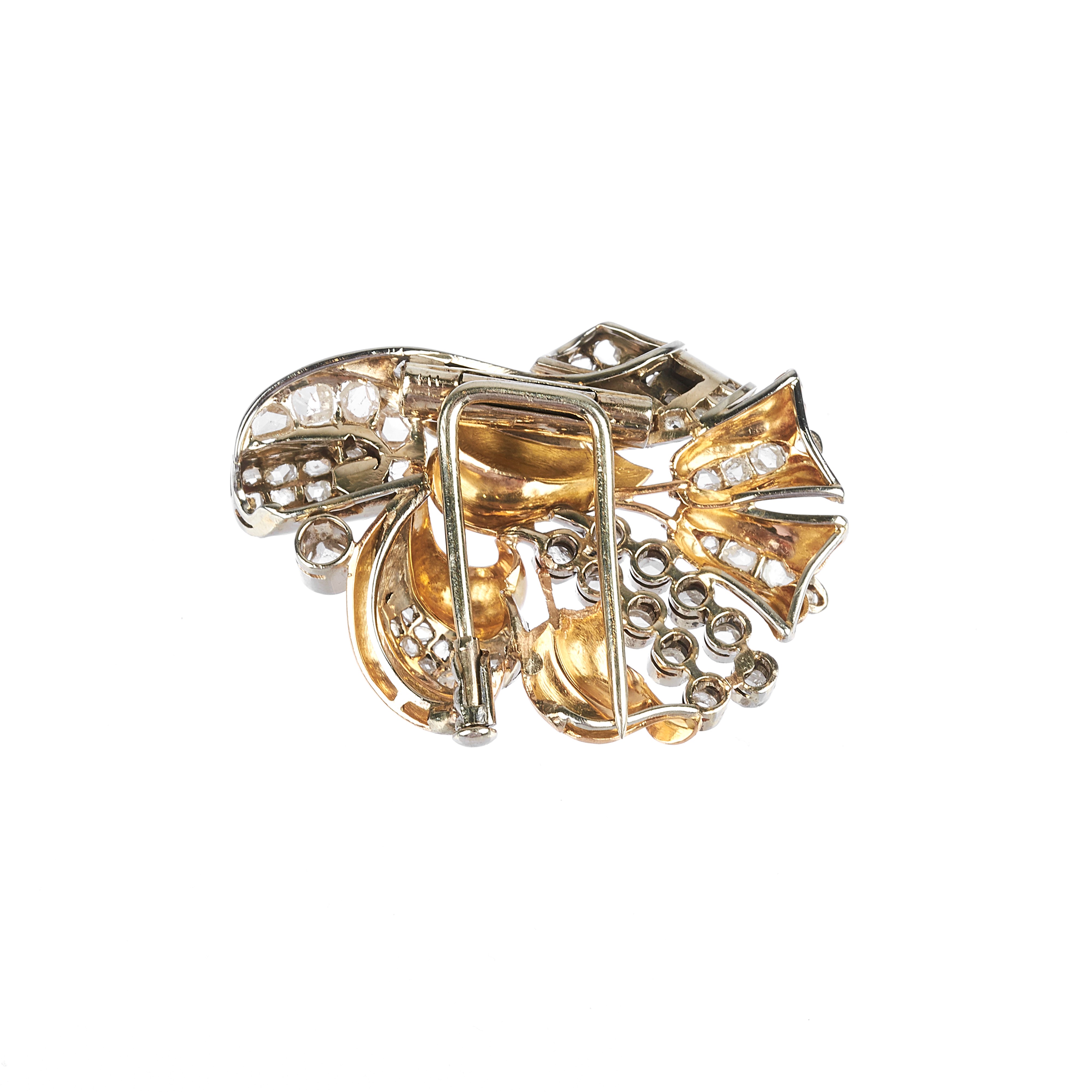Clip fantasia in oro giallo 18 kt, oro bianco e diamanti