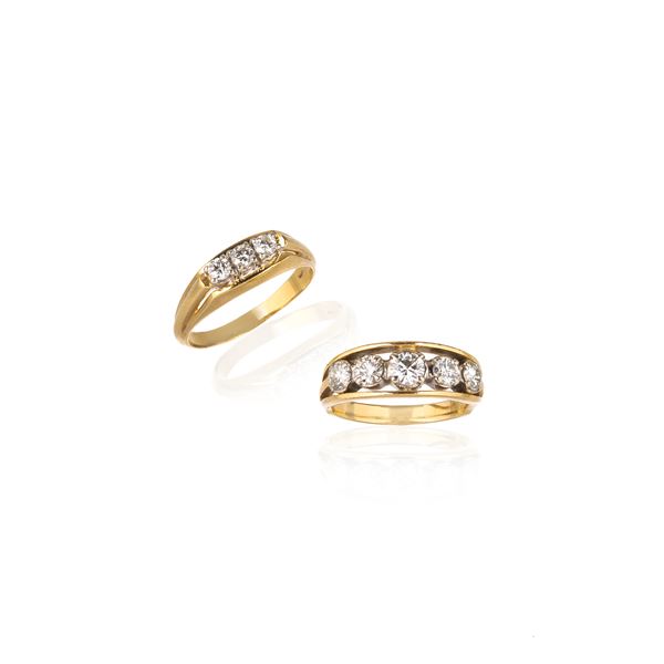18 kt yellow gold and diamond riviere ring and a similar one