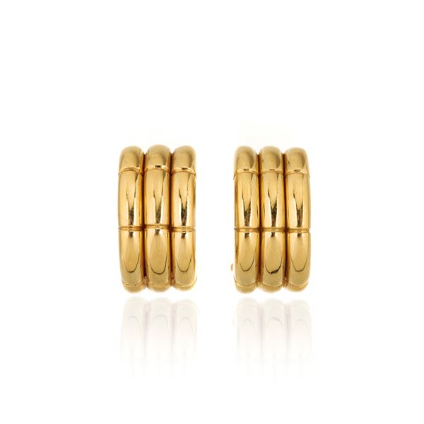 Paio di orecchini a clips, a semicerchio in oro giallo 18 kt
