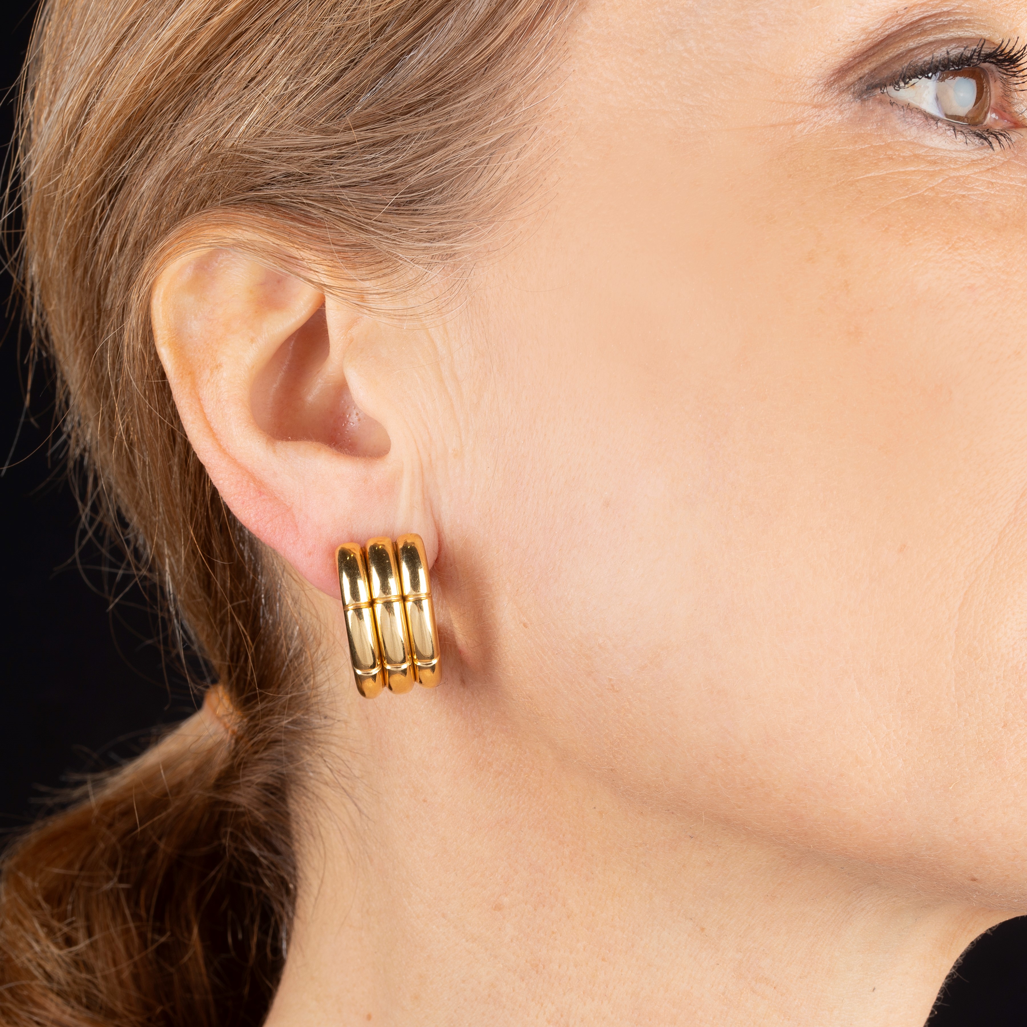 Paio di orecchini a clips, a semicerchio in oro giallo 18 kt