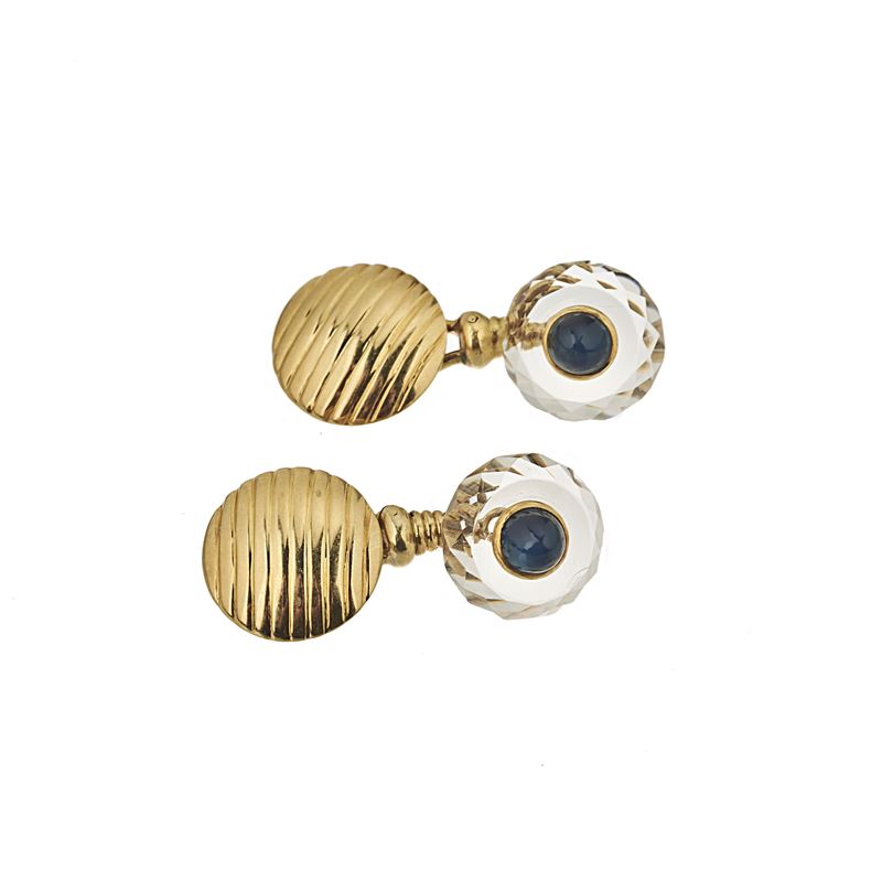 Paio di gemelli in oro giallo 18 kt, cristallo di rocca e lapislazzuli