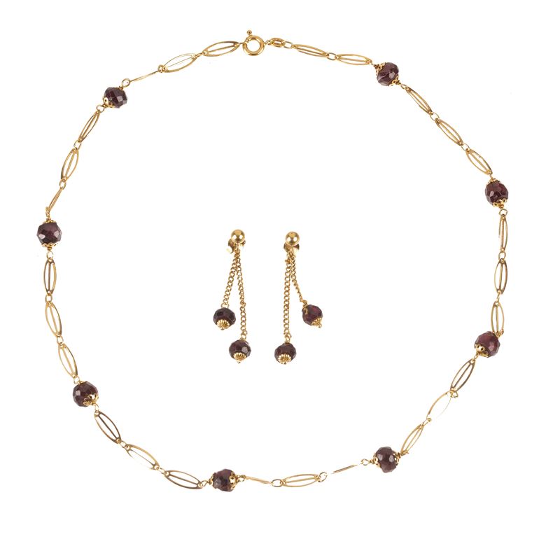 Paio di orecchini e girocollo in oro giallo 18 kt e granati