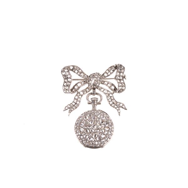 Bow brooch with 18 kt white gold watch and diamonds