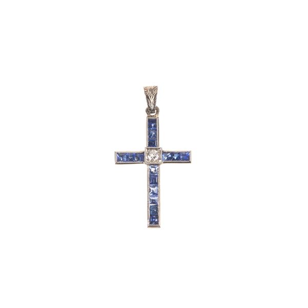 White gold cross, diamonds and blue synthetic stones