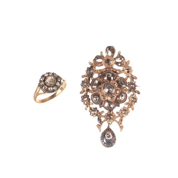 Pendente in oro 9 kt e diamanti e  e anello in oro a 14 kt, argento e diamanti