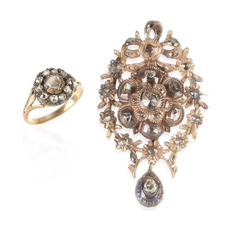 Pendente in oro 9 kt e diamanti e e anello in oro a 14 kt, argento e diamanti