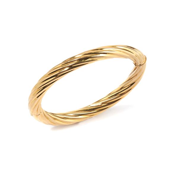 UNOAERRE - Rigid torchon bracelet in 18 kt yellow gold