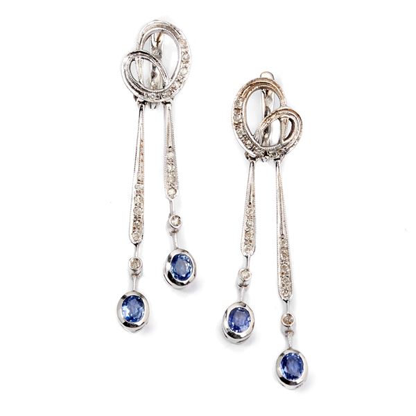 Pair of 18 kt white gold, diamond and sapphire pendant earrings