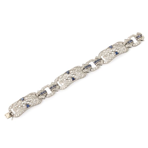 Importante bracciale in oro bianco 18 kt,  diamanti e pietre blu