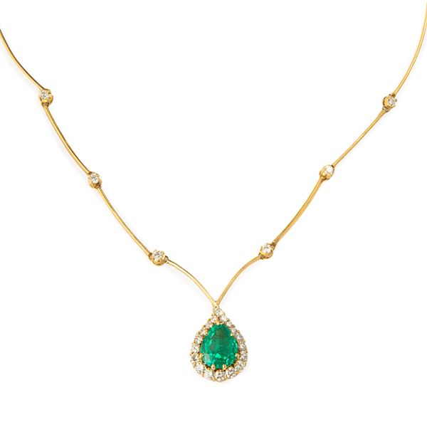 Semi-rigid necklace in 18 kt yellow gold, diamonds and emerald