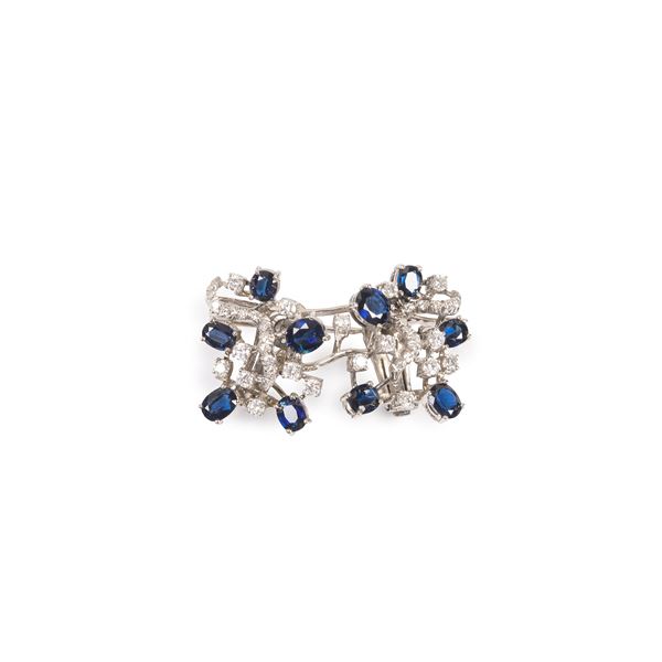 Brooch in 18 kt white gold, diamonds and sapphires