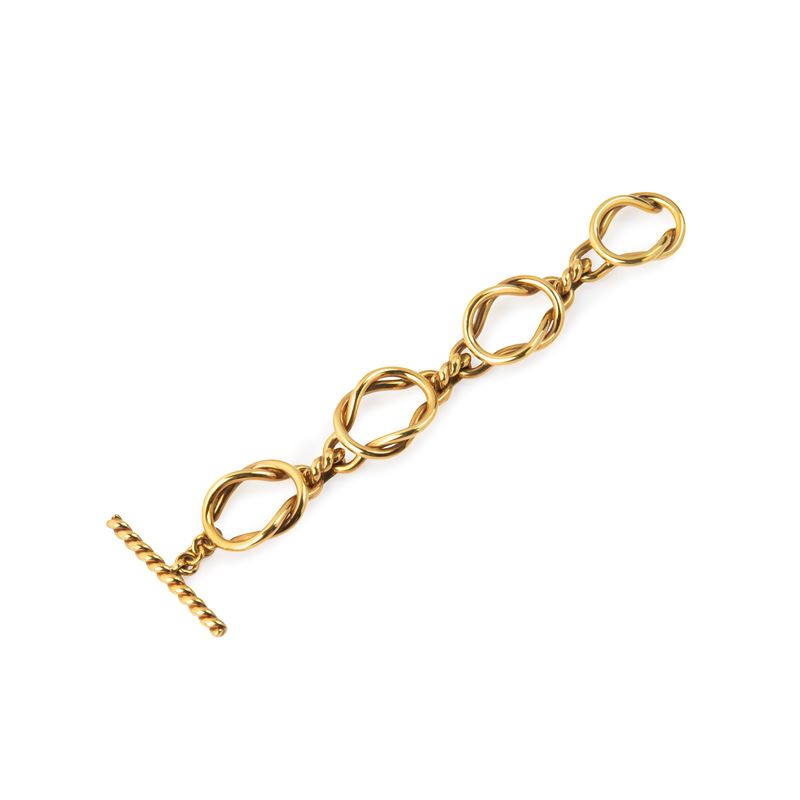 Grande bracciale con staffe intrecciate alternate a maglie a cordonetto in oro giallo 18 kt