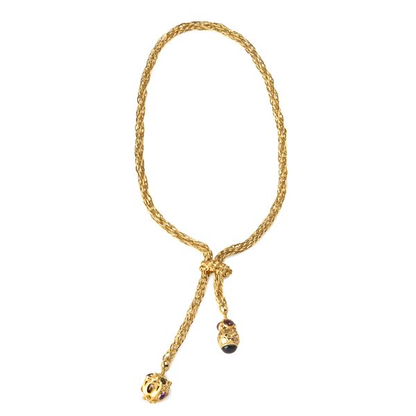 Long tubular latch necklace in 18 kt yellow gold with two chrms with semi-precious stones