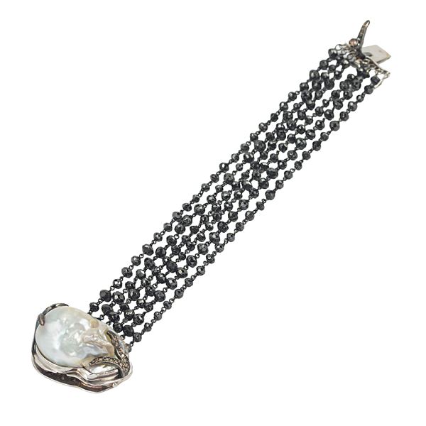 18kt white gold bracelet with black diamonds, a scaramazza pearl and brown diamonds