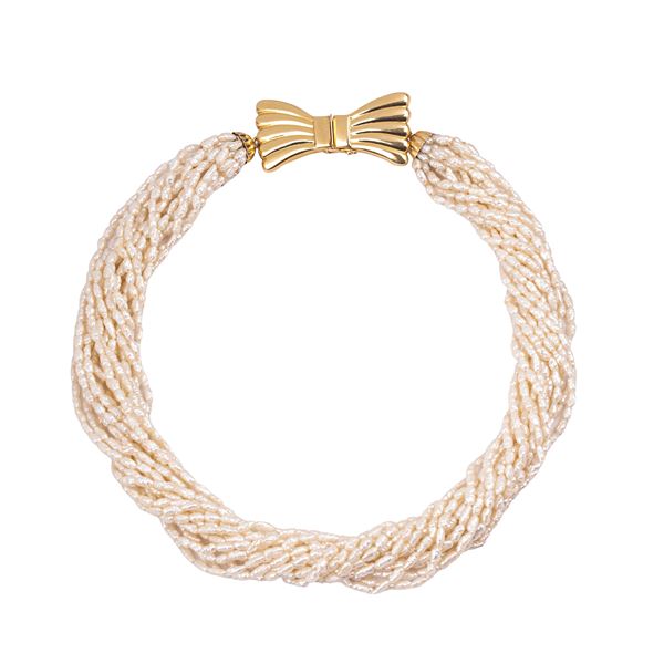 Multi-strand necklace in river pearls and 18 kt yellow gold