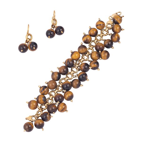 Pair of drop earrings and large bracelet in 18kt yellow gold and tiger's eye