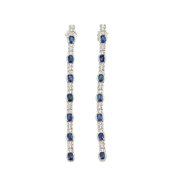 DAMIANI - Pair of long pendant earrings in 18 kt white gold, diamonds and sapphires