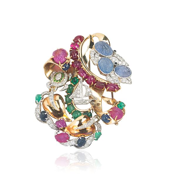 Large clip in 14 kt yellow and white gold, diamonds, rubies, sapphires and emeralds