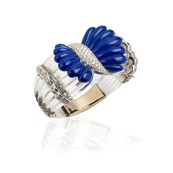 Large rigid bracelet in 18 kt white gold, rock crystal, diamonds and lapislazuli
