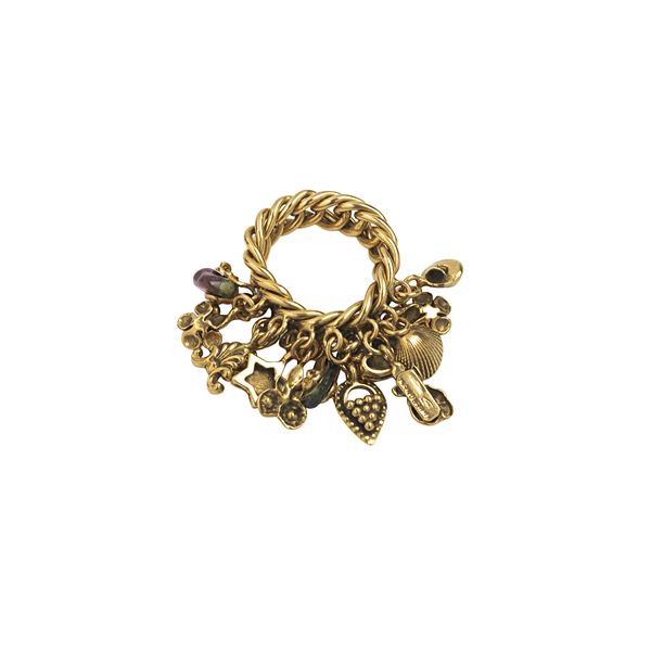 18 kt yellow gold pinky ring with 18 kt gold charms and  stones