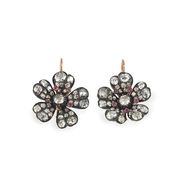 Pair of large pendant earrings made like a flower in 9 kt gold, silver, diamonds and rubies