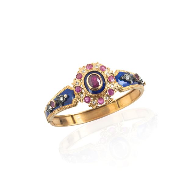 Rigid bracelet in 18 kt yellow gold, silver, blue enamel, diamonds, rubies