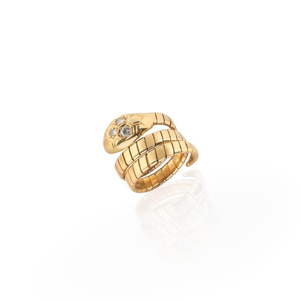 Snake ring in 18 kt yellow gold and diamonds