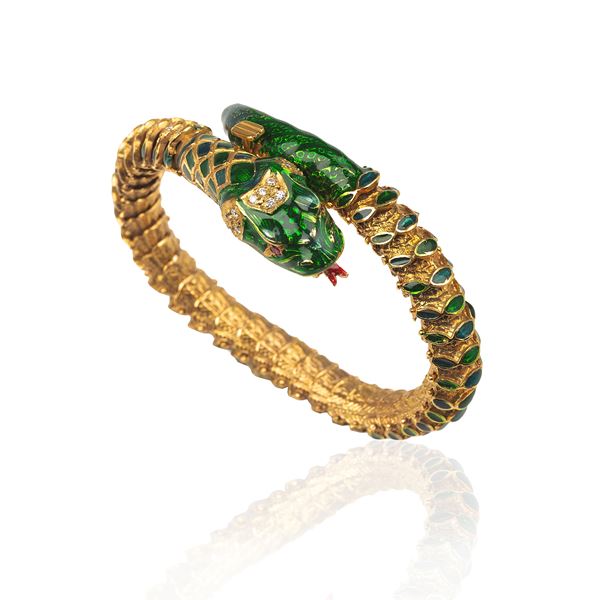 Snake articulated bracelet in 14 kt gold, diamonds, rubies and green enamel